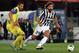 Andrea Pirlo searches for a teammate against Chievo.