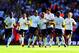 Assou-Ekotto (centre) celebrating a rare goal, against Liverpool on opening day in 09-10.