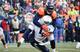 Von Miller makes a tackle against Tennessee
