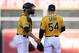 Stephen Vogt (left) talks to Sonny Gray on the hill during the ALDS.