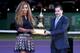 Serena Williams accepts a trophy at 2013 WTA Championships