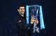 Novak Djokovic holds trophy at 2013 ATP World Tour Finals.