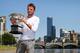 Stanislas Wawrinka poses with trophy after winning 2014 Australian Open.