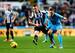 Nabil Bentaleb in battle with Mathieu Debuchy.