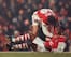 30 DEC 1995: ADRIAN CLARKE HELPS IAN WRIGHT CELEBRATE HIS GOAL FOR ARSENAL AGAINST WIMBLEDON IN THE PREMIER LEAGUE MATCH AT HIGHBURY. WIMBLEDON WON 3-1. Mandatory Credit: Anton Want/ALLSPORT