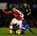 PORTSMOUTH, ENGLAND - DECEMBER 30: Aaron Mokoena of Portsmouth challenges Aaron Ramsey of Arsenal during the Barclays Premier League match between Portsmouth and Arsenal at Fratton Park on December 30, 2009 in Portsmouth, England. (Photo by Phil Cole/Ge