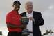 Donald Trump presented Tiger Woods the 2013 WGC-Cadillac trophy.