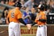 BALTIMORE, MD - SEPTEMBER 28: Brian Roberts #1 of the Baltimore Orioles celebrates with Chris Davis #19 after hitting a home run in the third inning against the Boston Red Sox at Oriole Park at Camden Yards on September 28, 2013 in Baltimore, Maryland.