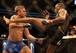 Alexander Gustafsson (left) exchanges blows with Jon Jones at UFC 165.