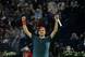 Roger Federer celebrates after winning in Dubai.