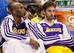 Kobe Bryant (left) rests on the bench.