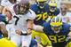 No. 92 Keith Heitzman reaches for the tackle.