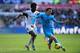 Vlad Chiriches holds off the challenge of Swansea's Wilfried Bony.