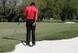 Tiger Woods approaches a bunker shot very carefully in the final round at Doral.