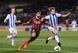 Barcelona's Martin Montoya jostles for possession.