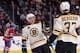 Boston Bruins forwards Brad Marchand and Patrice Bergeron celebrate a goal against the Montreal Canadiens.