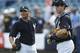 Not the return he envisioned; struggling Manny Banuelos (left) meets with catcher Pete O'Brien prior to being optioned
