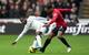 Nathan Dyer wins possession from Manchester United's left-back Patrice Evra.