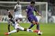 Kwadwo Asamoah and Juan Cuadrado battle in the Round of 16. Juve faces Lyon next week in the first leg of the quarterfinal.
