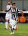 Carlos Tevez sizes up his options in Serie A action against Catania.