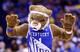 Double high-fives are in order for the Kentucky mascot, and the team, after advancing to the Final Four as a No. 8 seed.