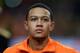 Netherlands' Memphis Depay listens to the national anthems during the lineup prior to the international friendly soccer match between Netherlands and Colombia at ArenA stadium in Amsterdam, Netherlands, Tuesday Nov. 19, 2013. (AP Photo/Peter Dejong)