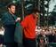 Tiger Woods accepts his first green jacket from Nick Faldo.