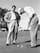 Ben Hogan putts under the watchful eye of Byron Nelson.