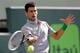 Novak Djokovic goes for a forehand at 2014 Sony Open in Miami.