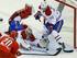 Montreal Canadiens Carey Price and Andrei Markov combine to make a save on Caroline Hurricanes forward Riley Nash.