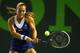 Dominika Cibulkova powers through her backhand at 2014 Sony Open.