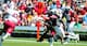 Carlton Heard (No. 83) catches a pass in the spring game.