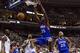 Henry Sims slams it down as Brandon Davies marvels.