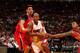 Gustavo Ayon defends against driving Miami Heat guard Ray Allen.