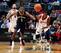 DeMarre Carroll fends off New Orleans Pelicans guard Tyreke Evans for a loose ball.