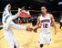 John Jenkins (right) slaps hands with teammate Louis Williams.