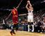 Hawks guard Kyle Korver shoots over Cleveland Caveliers forward Luol Deng.