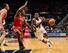 Shelvin Mack drives against Milwaukee Bucks guard Brandon Knight.