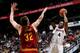 Paul Millsap shoots over Cleveland Cavaliers center Spencer Hawes.