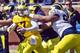 No.90 Bryan Mone reaches for No.7 Shane Morris.