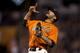 Sergio Romo celebrates closing out a victory against the Rockies.
