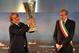Michel Platini plays his part in the Europa League trophy ceremony in Turin.