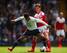 Scott Parker battles it out with Paulinho.