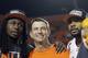 Clemson head coach Dabo Swinney surrounded by former stars Sammy Watkins (left) and Tajh Boyd (right).