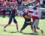 Arkansas C Travis Swanson (middle) is a smart technician at center.