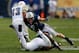 BYU S Daniel Sorensen (9, above) is a willing tackler and a smart football player.