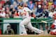 Yadier Molina gets a hit against the Washington Nationals on April 17.
