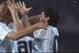 Caniggia, left, celebrates with Diego Maradona.