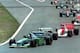 Schumacher passes Senna into the first corner of the 1994 Pacific Grand Prix.