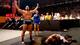 Alexander Rusev leaves Xavier Woods lying motionless.